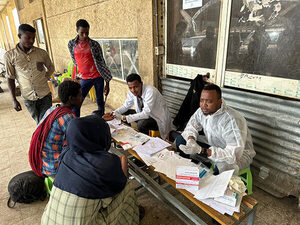 photo of people volunteering for malaria testing